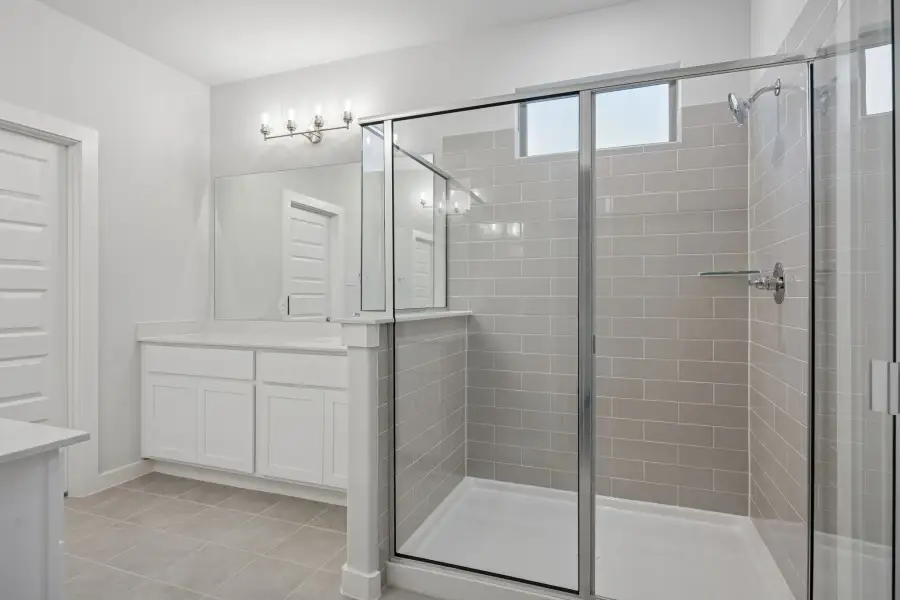Primary Bathroom in the Wimbledon home plan by Trophy Signature Homes – REPRESENTATIVE PHOTO Primary Bathroom in the Wimbledon home plan by Trophy Signature Homes – REPRESENTATIVE PHOTO