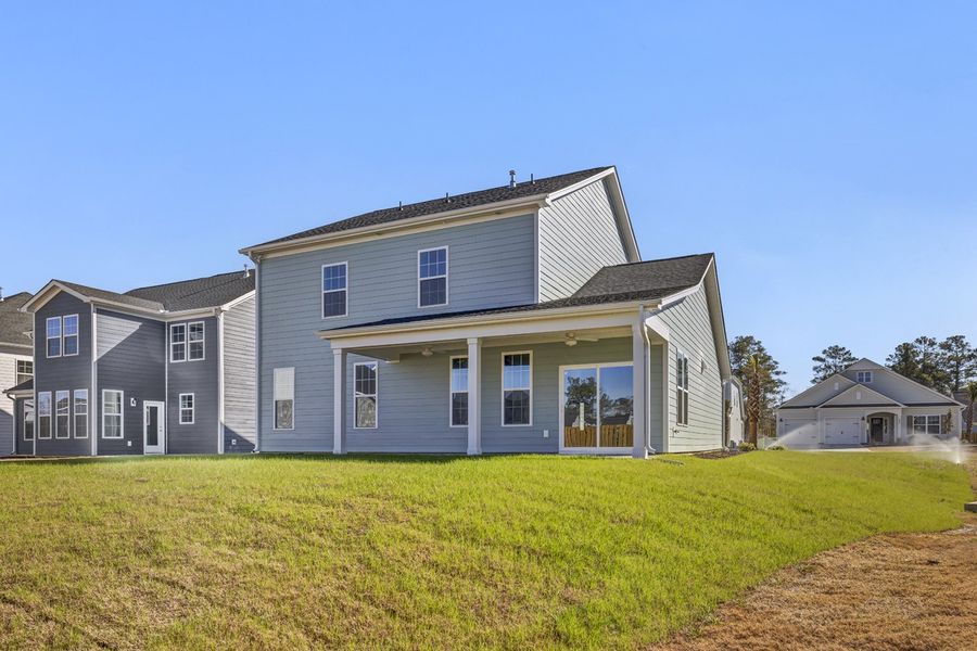 Exterior details and patio area of a home in Grand Park, Leland (Image 18).