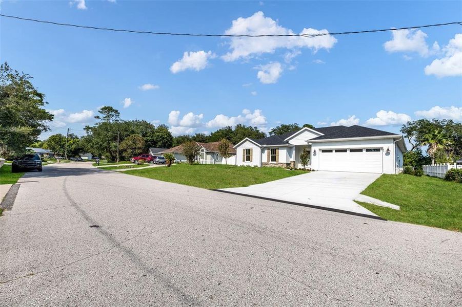 Front exterior of a new home in , Palm Coast, FL, highlighting curb appeal (Image 23).