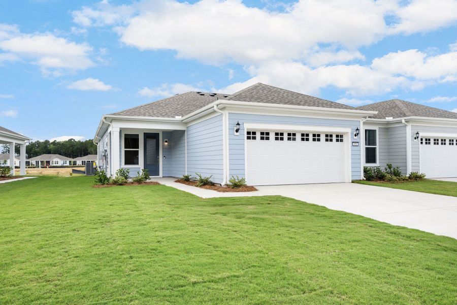 Front exterior of a new home in Sun City Hilton Head, Bluffton, SC, highlighting curb appeal (Image 20).