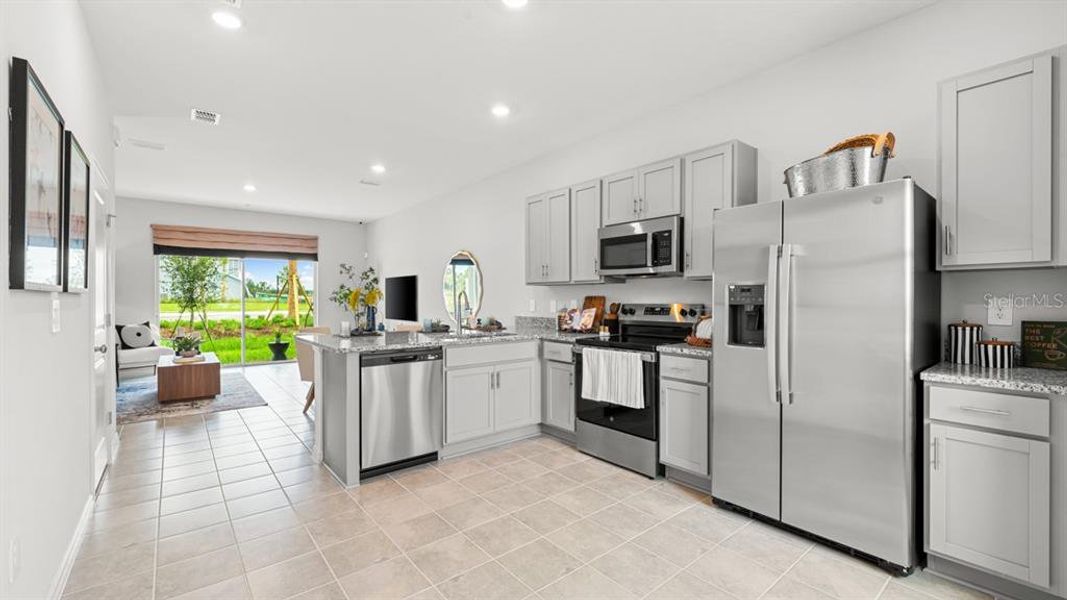 Furnished interior view inside a new home in Westview Community Group Page, Kissimmee (Image 8).