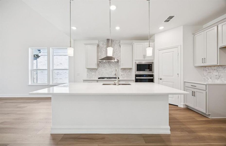High-end gourmet kitchen with premium finishes and upgraded appliances *Model representation High-end gourmet kitchen with premium finishes and upgraded appliances *Model representation