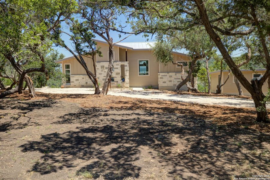 Front exterior of a new home in , New Braunfels, TX, highlighting curb appeal (Image 26). Front exterior of a new home in , New Braunfels, TX, highlighting curb appeal (Image 26).