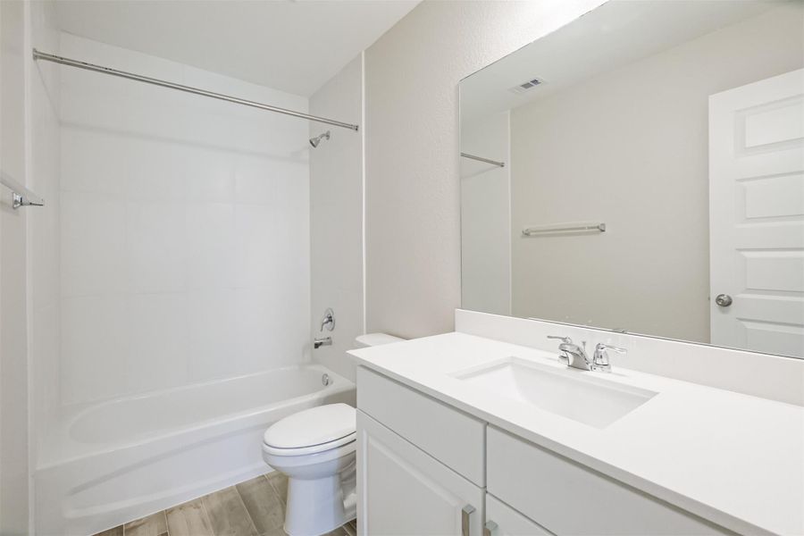 Photos are sample images from a previously built home with the same floor plan. Finishes and fixtures in the current home have been upgraded and may vary.