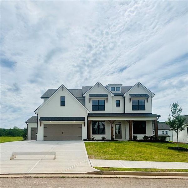 Front exterior of a new home in Rosewood Lake Estates, Hoschton, GA, highlighting curb appeal (Image 2). Front exterior of a new home in Rosewood Lake Estates, Hoschton, GA, highlighting curb appeal (Image 2).