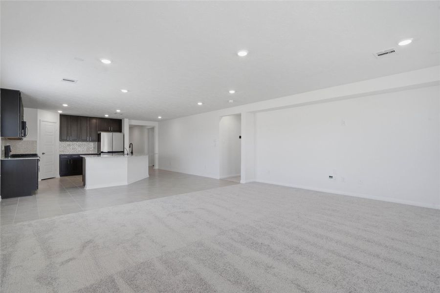 Stunning open-concept design seamlessly connecting the living, dining, and kitchen areas—perfect for both everyday living and entertaining!