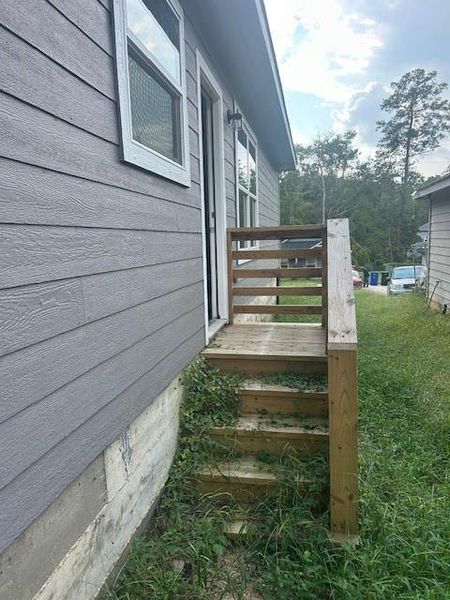 Exterior details and patio area of a home in Frontier Lakes, Willis (Image 22). Exterior details and patio area of a home in Frontier Lakes, Willis (Image 22).