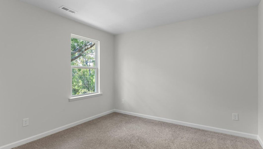 Representative unfurnished interior of a home built from the WOODSTOCK by D.R. Horton in Surfside Landing, Hubert (Image 34).