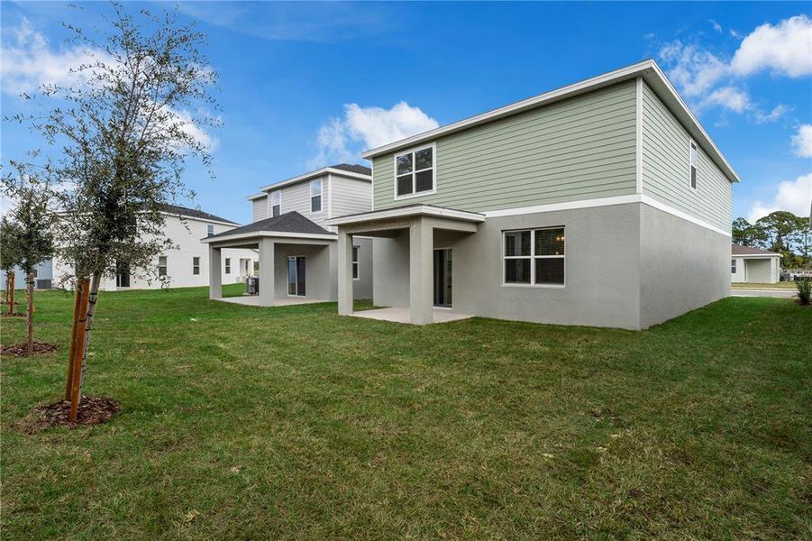 Exterior details and patio area of a home in Watermark, Cocoa (Image 24).