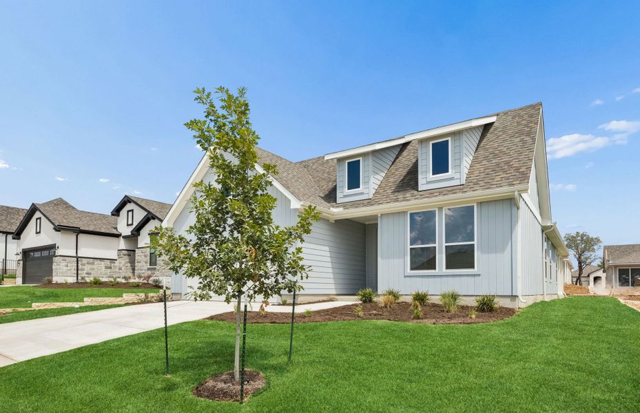 Front exterior of a new home in Sun City Texas, Georgetown, TX, highlighting curb appeal (Image 17).