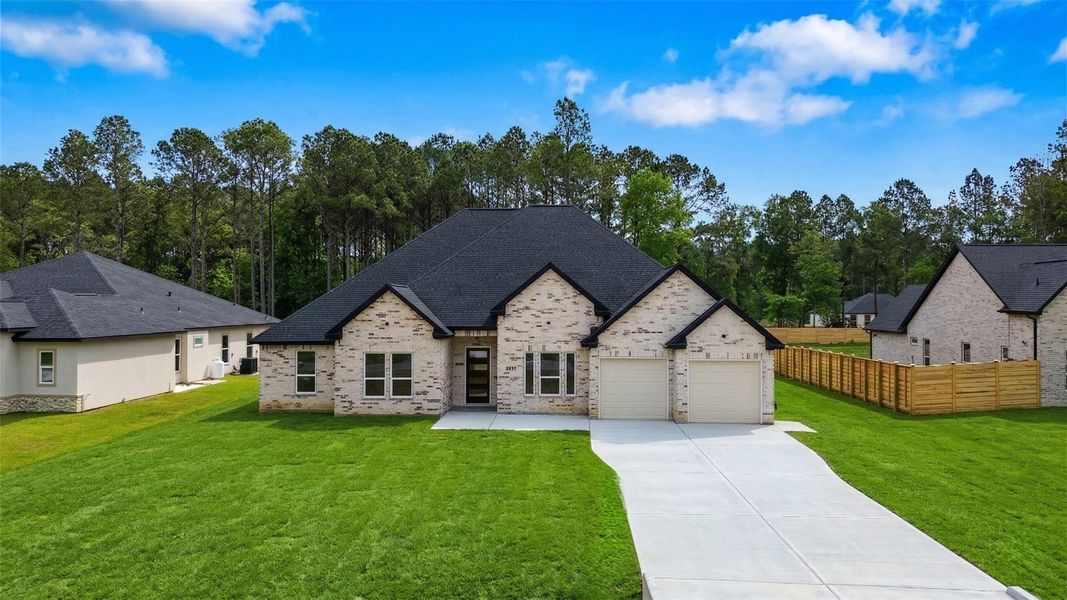 Front exterior of a new home in , Dayton, TX, highlighting curb appeal (Image 20). Front exterior of a new home in , Dayton, TX, highlighting curb appeal (Image 20).