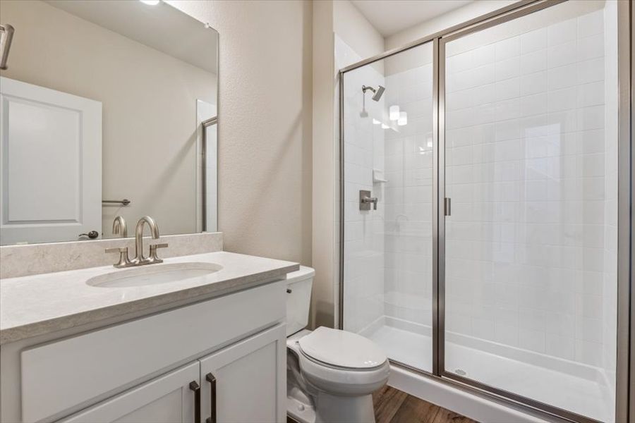A bathroom with a glass shower.