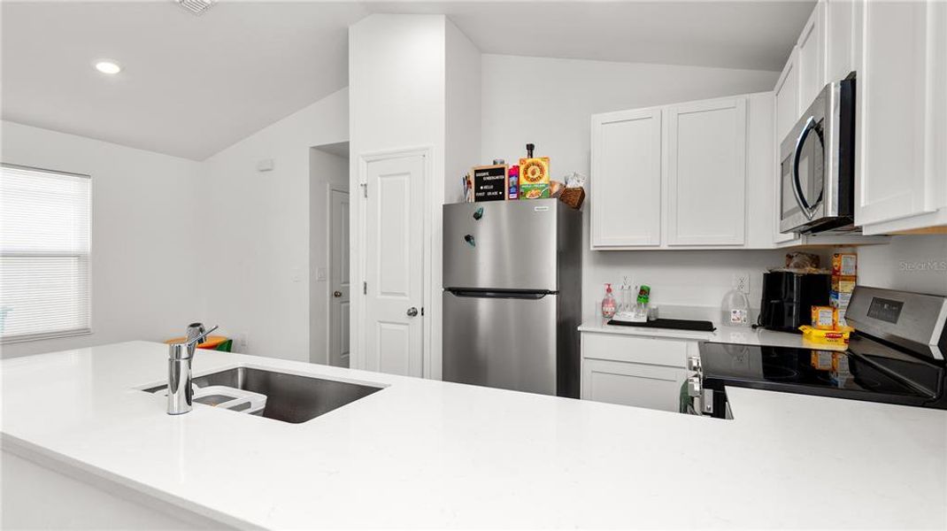 Furnished interior view inside a new home in Peace Creek Reserve: Legacy Collection, Winter Haven (Image 13).