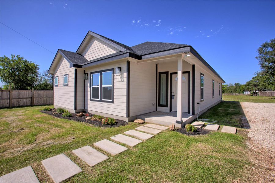 Front exterior of a new home in , Bastrop, TX, highlighting curb appeal (Image 21). Front exterior of a new home in , Bastrop, TX, highlighting curb appeal (Image 21).