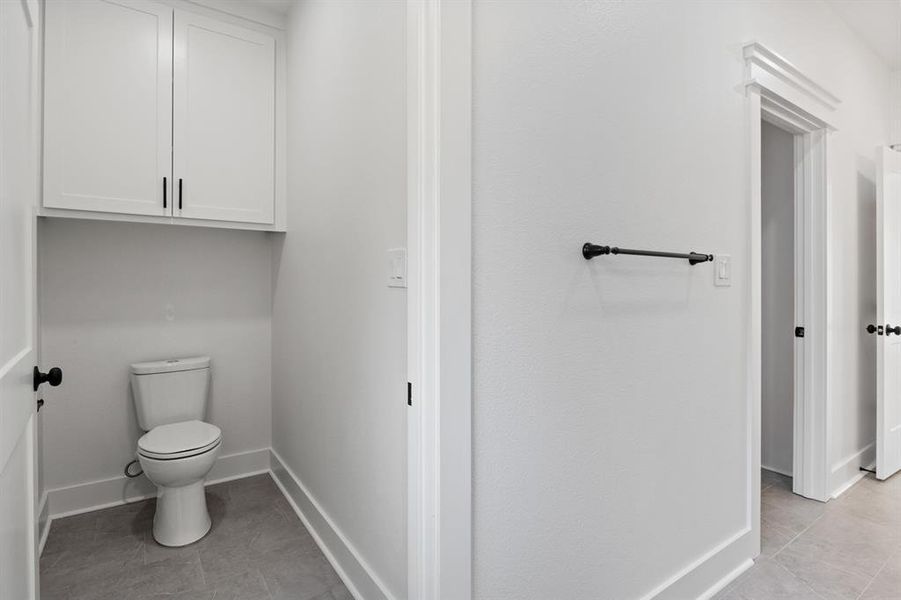 Bathroom featuring light tile patterned flooring