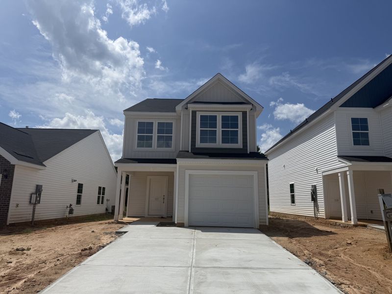 Front exterior of a new home in Laurinton Farms, Hopkins, SC, highlighting curb appeal (Image 1). Front exterior of a new home in Laurinton Farms, Hopkins, SC, highlighting curb appeal (Image 1).