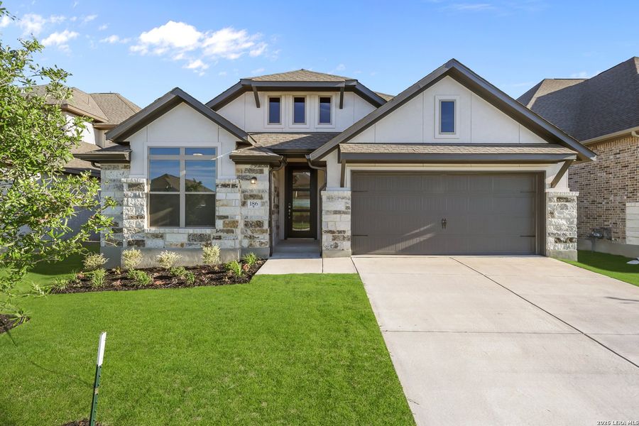 Front exterior of a new home in Nopal Valley, San Antonio, TX, highlighting curb appeal (Image 23).