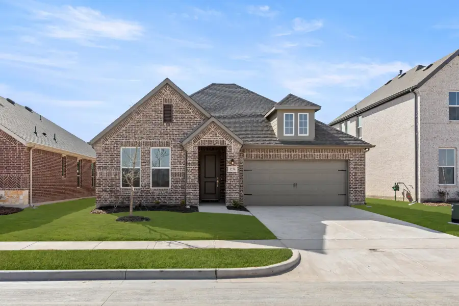 Representative exterior photo of a completed home built from the Liberty by Rockwell Homes in Walden Pond, Forney, TX (Image 1). Representative exterior photo of a completed home built from the Liberty by Rockwell Homes in Walden Pond, Forney, TX (Image 1).