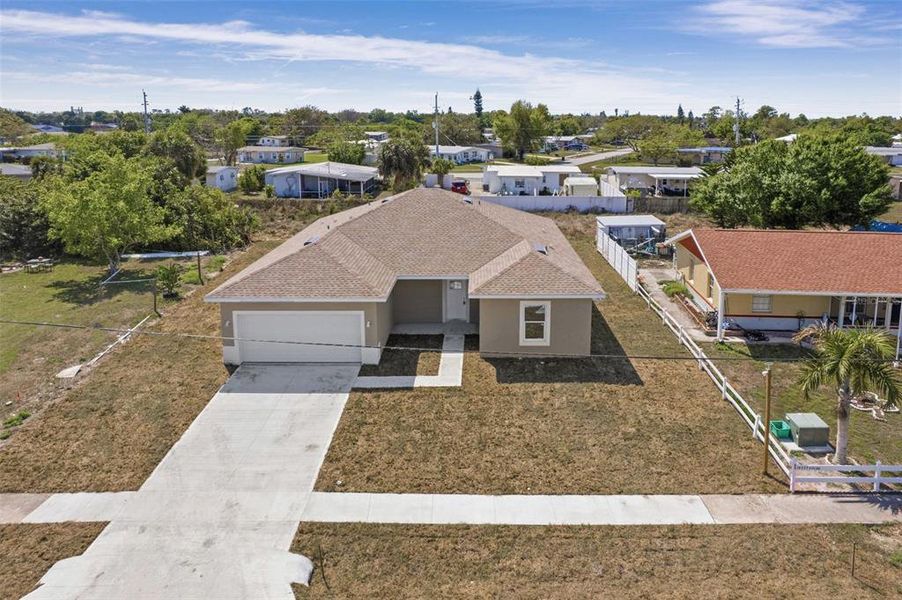Front exterior of a new home in , Port Charlotte, FL, highlighting curb appeal (Image 21).