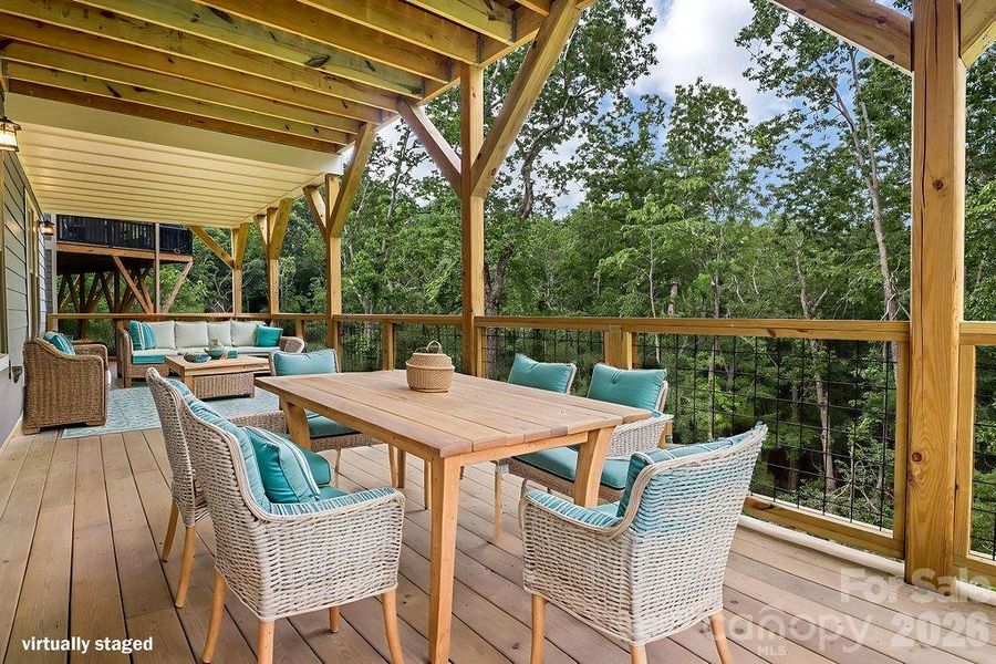 Virtually staged Lower level deck overlooking private wooded view.