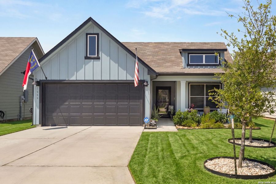 Front exterior of a new home in Saengerhalle Meadows, New Braunfels, TX, highlighting curb appeal (Image 2). Front exterior of a new home in Saengerhalle Meadows, New Braunfels, TX, highlighting curb appeal (Image 2).