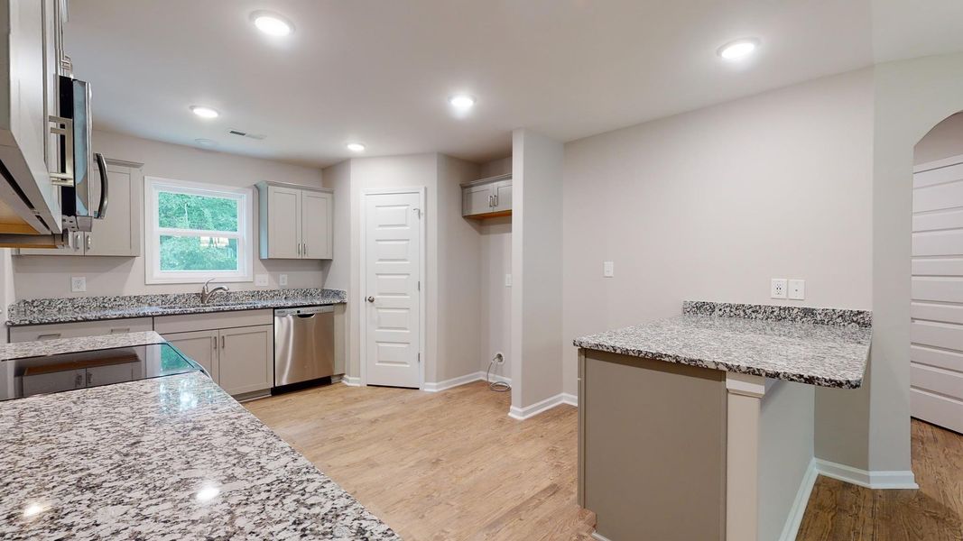 Representative furnished interior of a home built from the Kids 2 Car by JC Jackson Homes,LLC in Heritage Pointe, Newport (Image 8).