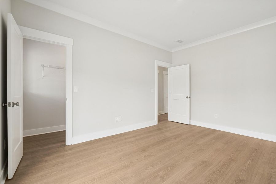 Spacious, unfurnished interior of a new home in Hidden Ponds Reserve, Awendaw (Image 11).