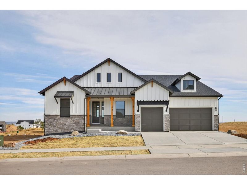 Front exterior of a new home in RainDance, Windsor, CO, highlighting curb appeal (Image 2).