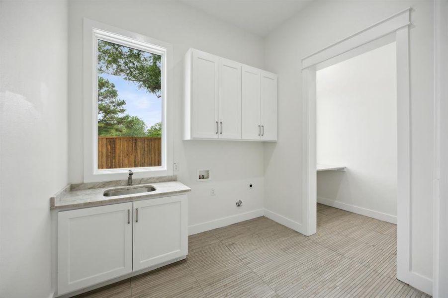 Large Laundry with Utility Sink, Storage galore; Hobby Room with wall of Cabinets next to Utility