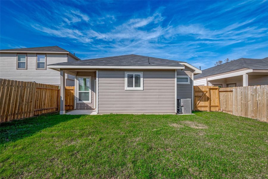 Exterior details and patio area of a home in Mill Creek Trails, Magnolia (Image 25).