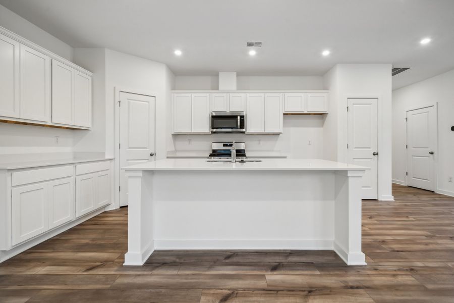 A kitchen with white cabinets. A kitchen with white cabinets.