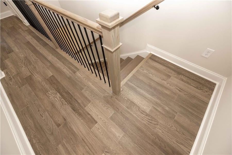 Hard surface flooring in all hallways and open rails in staircases is included in price - *Image is of previously built home* Hard surface flooring in all hallways and open rails in staircases is included in price - *Image is of previously built home*