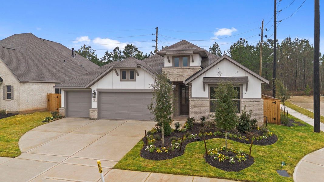 Front exterior of a new home in Escondido, Magnolia, TX, highlighting curb appeal (Image 20).