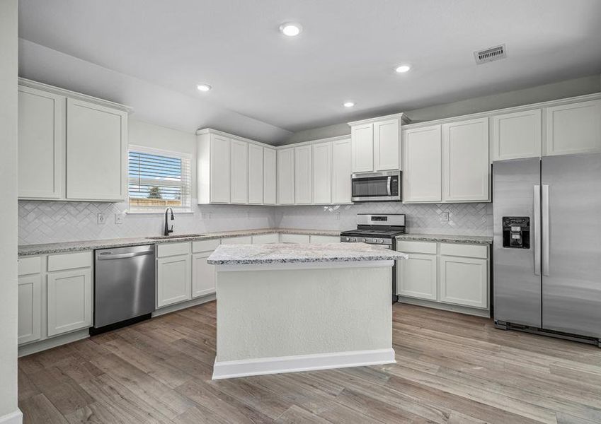 Chef ready kitchen with white cabinets and stainless steel appliances