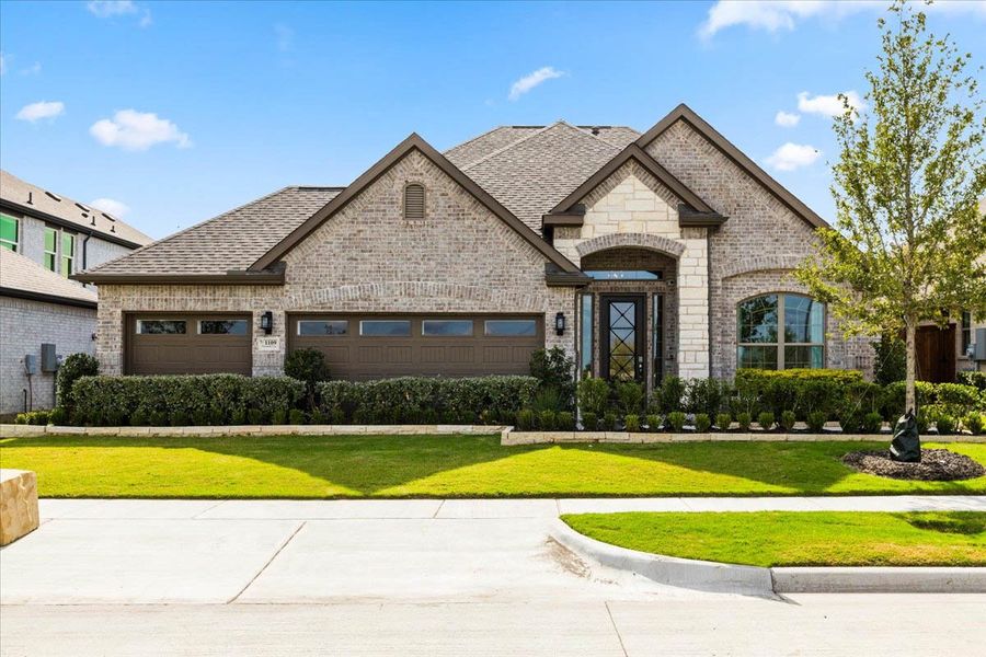 Front exterior of a new home in Las Lomas, Forney, TX, highlighting curb appeal (Image 15). Front exterior of a new home in Las Lomas, Forney, TX, highlighting curb appeal (Image 15).