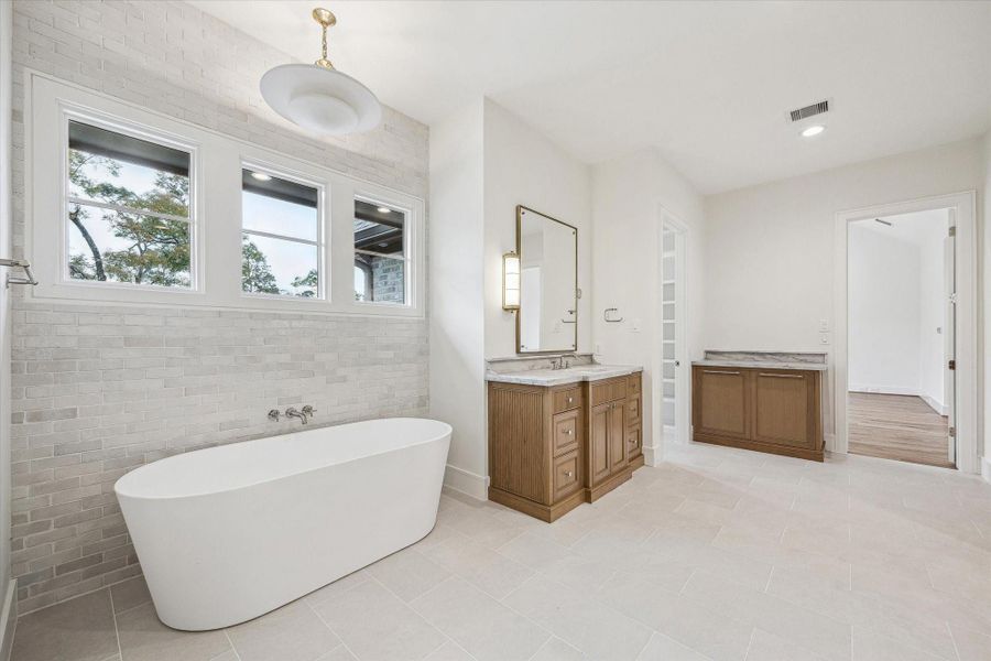 Another view of spacious primary bath with great natural lighting! High end finishes abound! Another view of spacious primary bath with great natural lighting! High end finishes abound!