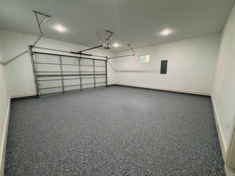 Garage well lit with recessed lights or natural lighting with thoughtfully placed windows for natural lighting.