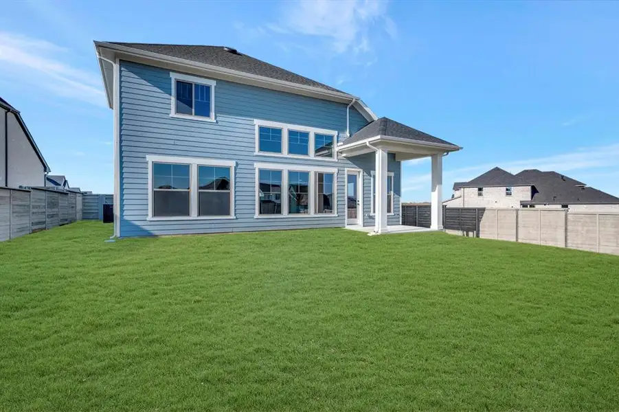Exterior details and patio area of a home in Treeline, Justin (Image 3).