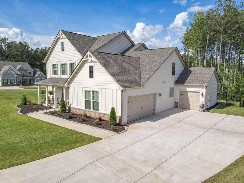 Front exterior of a new home in , Senoia, GA, highlighting curb appeal (Image 26). Front exterior of a new home in , Senoia, GA, highlighting curb appeal (Image 26).