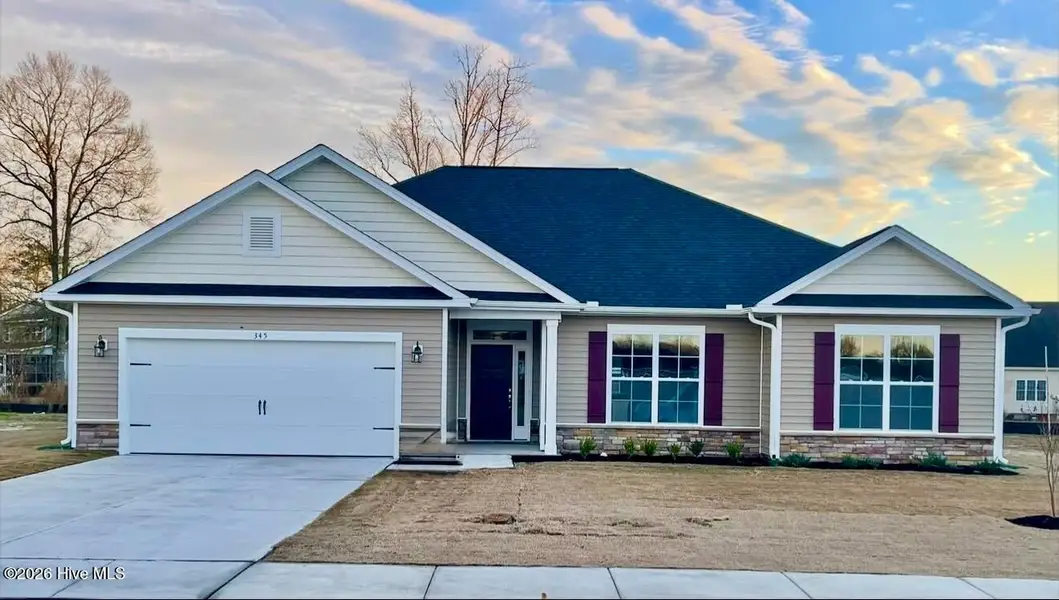 Front exterior of a new home in Summer Place, Grimesland, NC, highlighting curb appeal (Image 1). Front exterior of a new home in Summer Place, Grimesland, NC, highlighting curb appeal (Image 1).