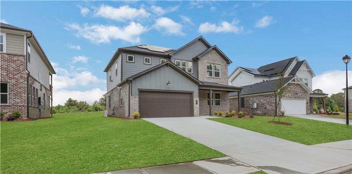 Front exterior of a new home in Easton Walk, Lawrenceville, GA, highlighting curb appeal (Image 21). Front exterior of a new home in Easton Walk, Lawrenceville, GA, highlighting curb appeal (Image 21).