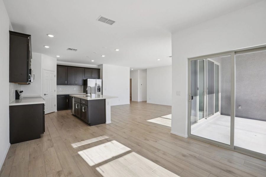 Dining, kitchen and great room. Not actual home, finishes and options may vary.
