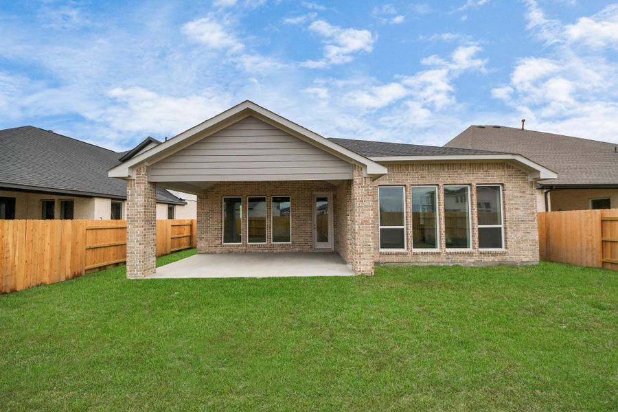 Front exterior of a new home in 50' Traditional Homes at Elyson, Katy, TX, highlighting curb appeal (Image 24). Front exterior of a new home in 50' Traditional Homes at Elyson, Katy, TX, highlighting curb appeal (Image 24).
