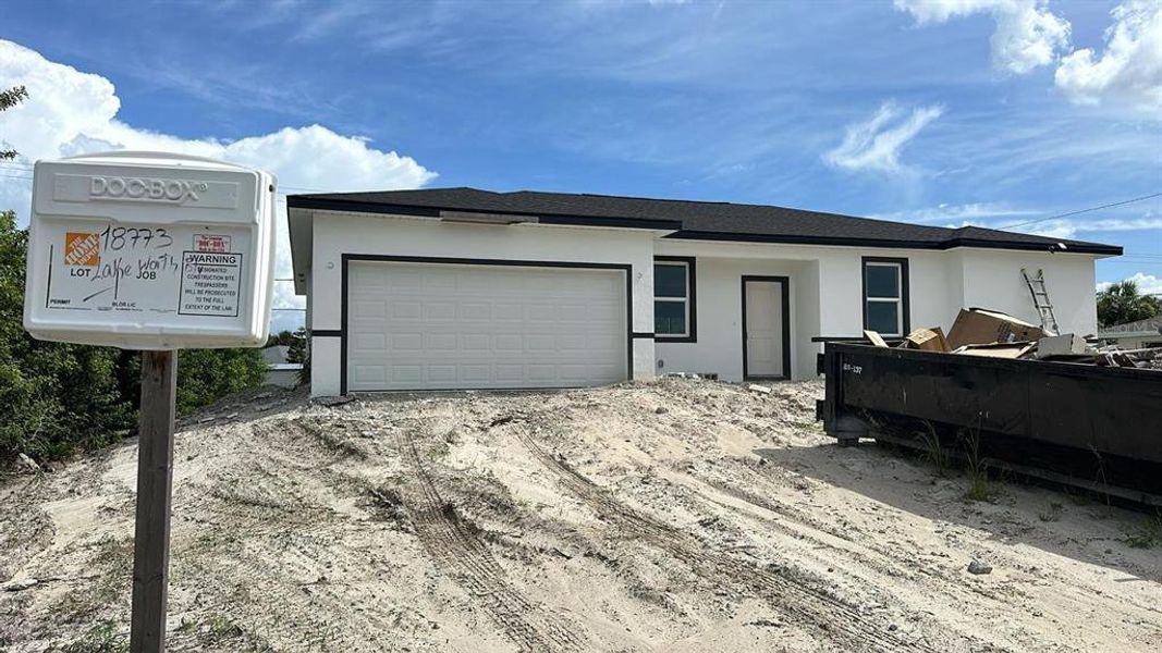 Front exterior of a new home in , Port Charlotte, FL, highlighting curb appeal (Image 2). Front exterior of a new home in , Port Charlotte, FL, highlighting curb appeal (Image 2).
