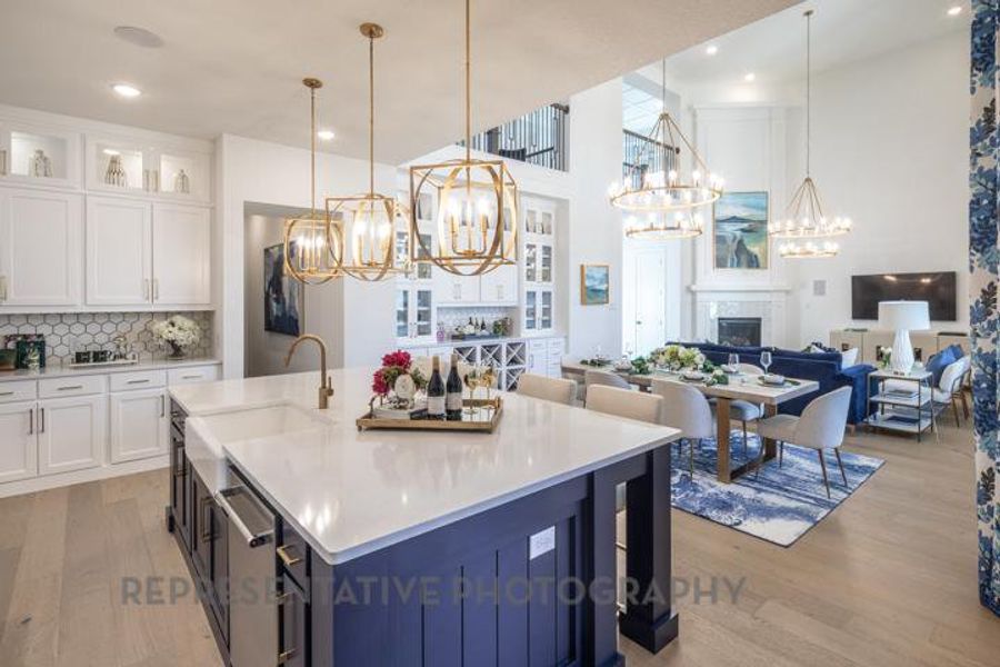 Kitchen featuring a sink, light wood-type flooring, dishwasher, a chandelier, and open floor plan Kitchen featuring a sink, light wood-type flooring, dishwasher, a chandelier, and open floor plan