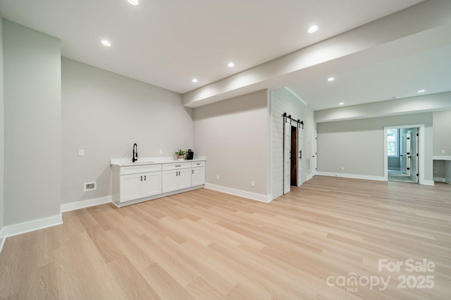 The Lower Level boasts a large Wet Bar or Coffee Bar for entertaining