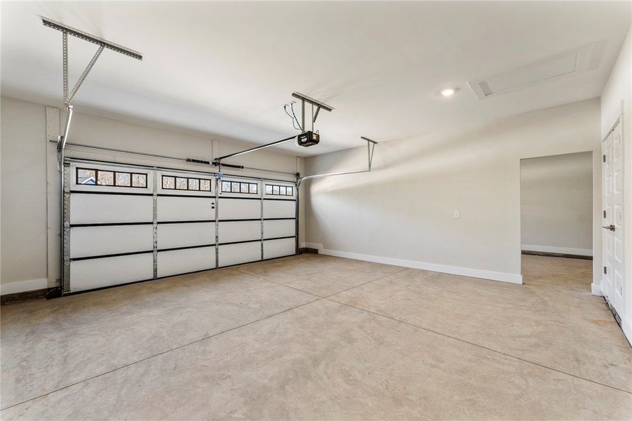 This spacious garage features a clean concrete flo This spacious garage features a clean concrete flo