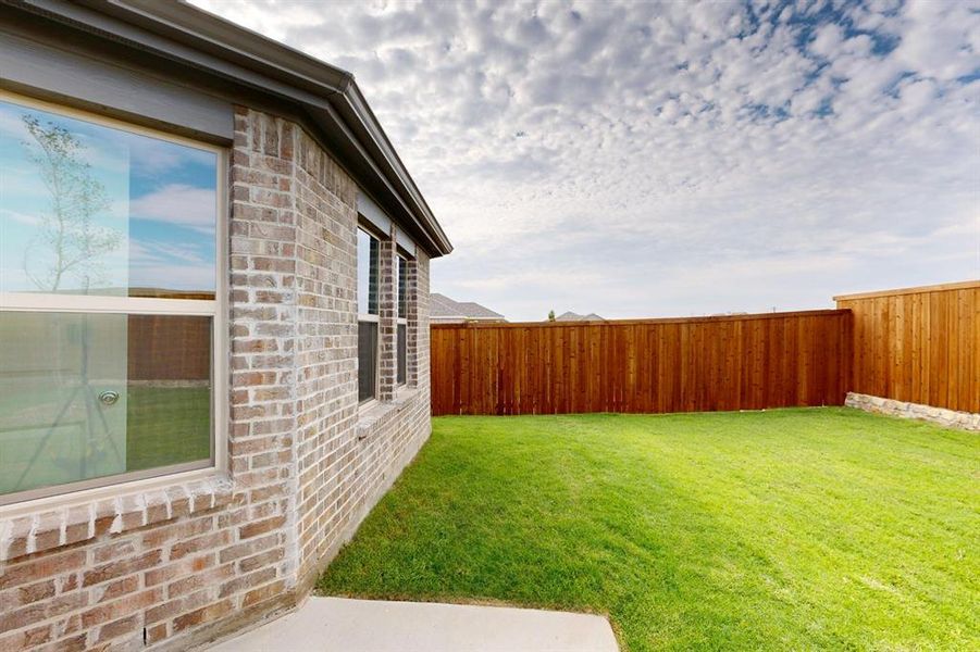 Exterior details and patio area of a home in Mobberly Farms, Pilot Point (Image 4). Exterior details and patio area of a home in Mobberly Farms, Pilot Point (Image 4).