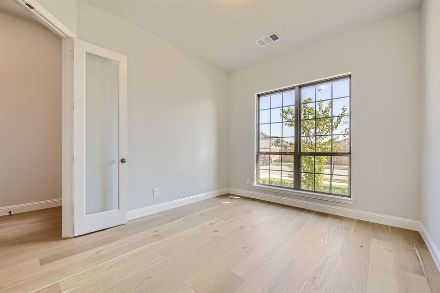 Spare room featuring light hardwood / wood-style flooring