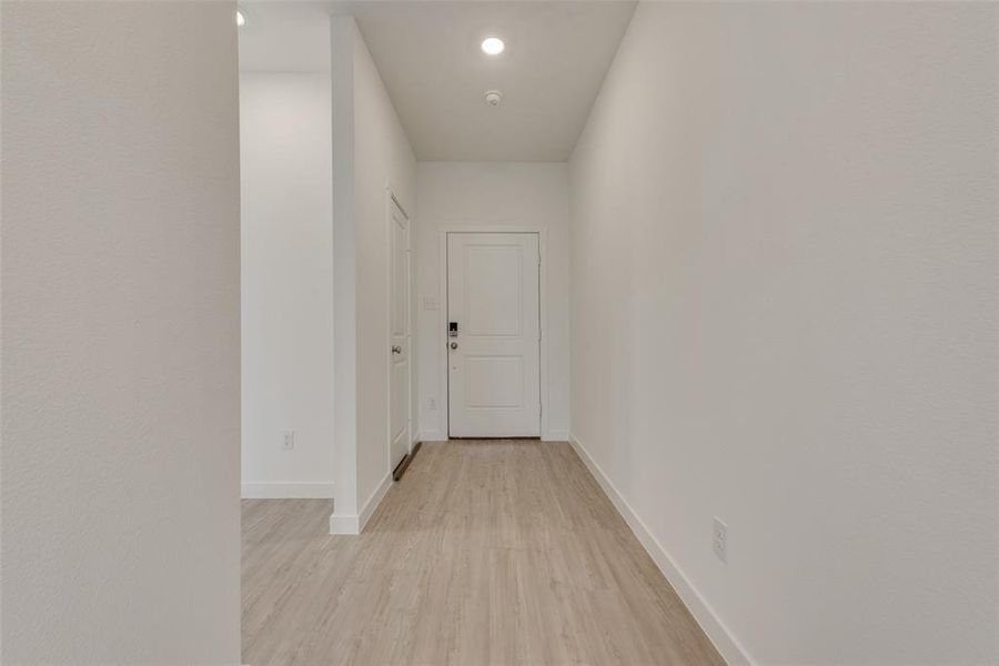 Hallway featuring light hardwood / wood-style floors